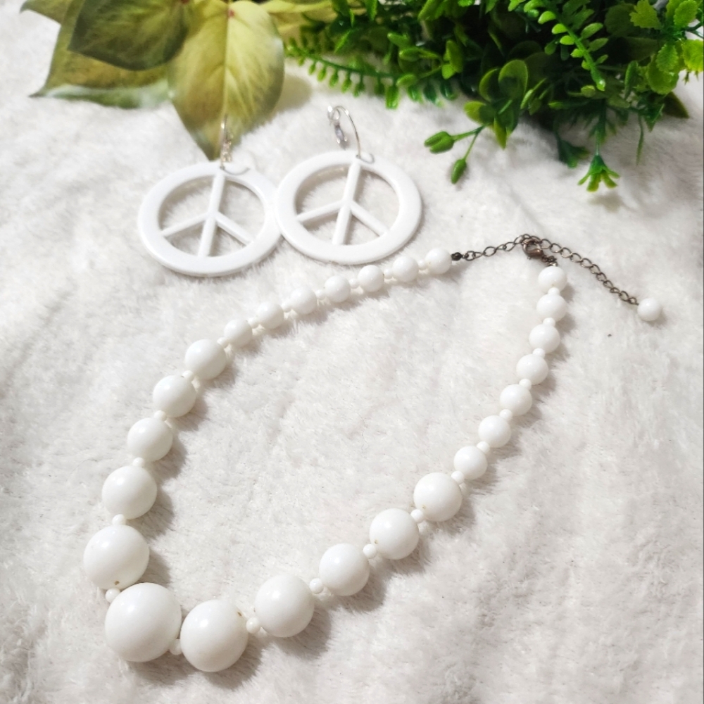 White Peace sign earrings and a matching white plastic necklace